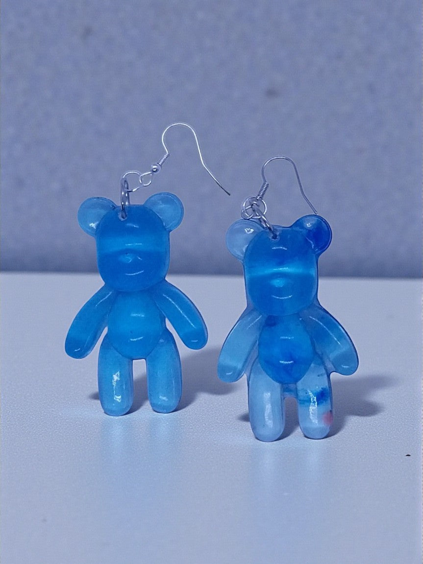 Artymunk3y translucent blue bear dangle earrings with silver-plated hooks. Gradient blue resin with subtle color swirls.